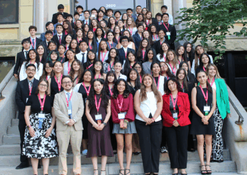 NHI students standing on stairs for group photo at 2025 Midwest Great Debate at Augustana College