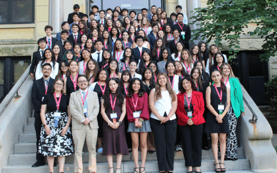 NHI students standing on stairs for group photo at 2025 Midwest Great Debate at Augustana College