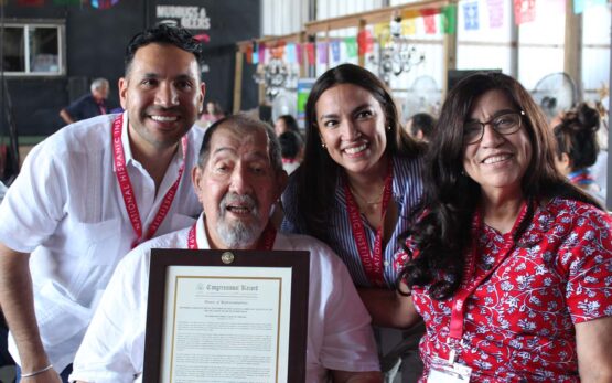 Carlos Paz, Ernesto Nieto, Rep. Alexandria Ocasio-Cortez, and Gloria de Leon with Congressional Record proclamation for Nieto