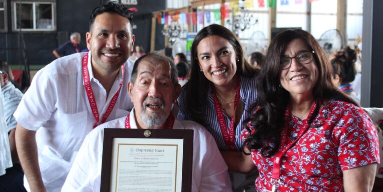 Carlos Paz, Ernesto Nieto, Rep. Alexandria Ocasio-Cortez, and Gloria de Leon with Congressional Record proclamation for Nieto