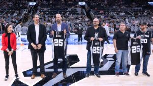 roy and chris nieto receiving an award from the san antonio spurs for nhi and ernesto nieto