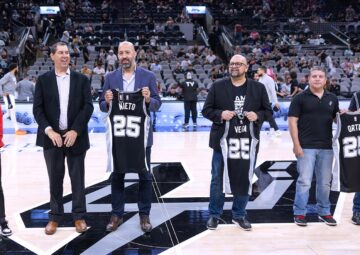 roy and chris nieto receiving an award from the san antonio spurs for nhi and ernesto nieto
