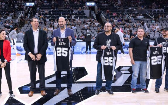 roy and chris nieto receiving an award from the san antonio spurs for nhi and ernesto nieto