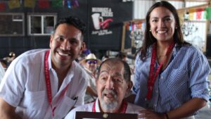 Former NHI Persons of the year Carlos Paz and Alexandria Ocasio-Cortez with Ernesto Nieto