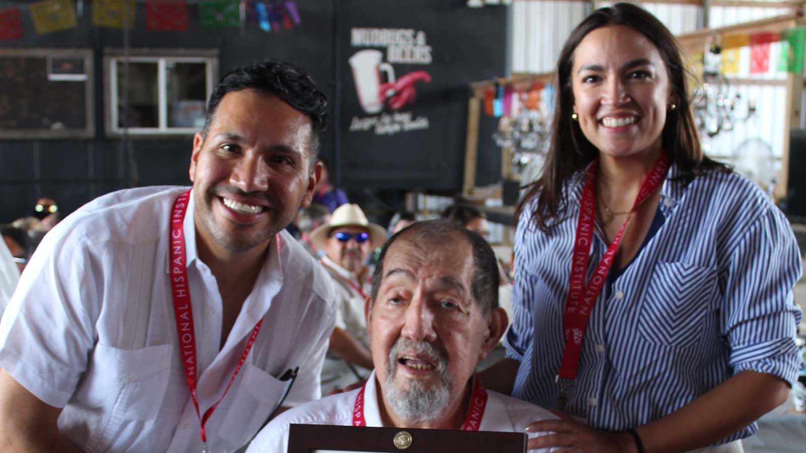 Former NHI Persons of the year Carlos Paz and Alexandria Ocasio-Cortez with Ernesto Nieto
