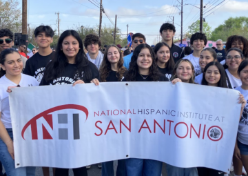 Group of NHI@SA students holding banner
